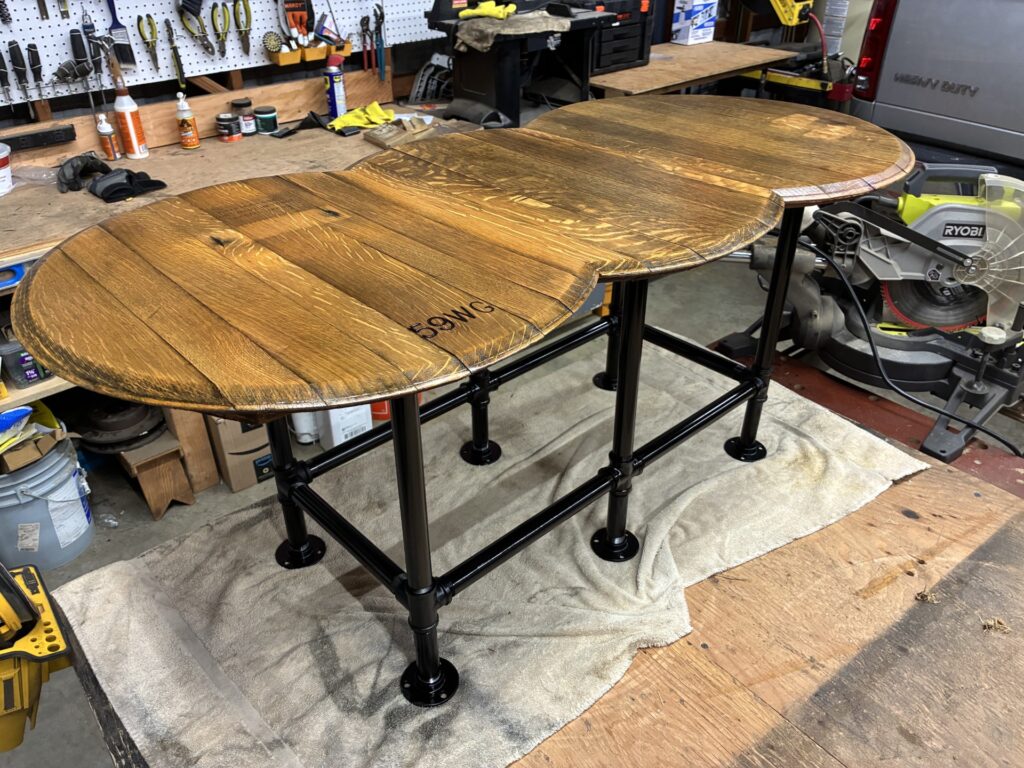 rustic look Custom made dinning room table out of barrel tops.